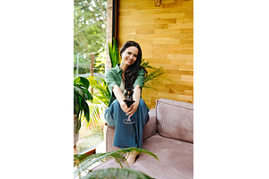Portrait of smiling woman enjoying a, a Person Photo by HalfPoint