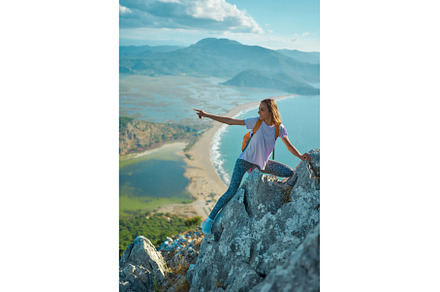 Active traveler hiker girl stands on, a Person Photo by vitaliymateha photography