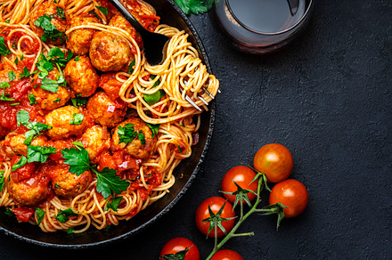 Prepared spaghetti pasta with fried pork meatballs in tomato sau, a Food & Drink Photo by 5PH
