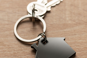 House keys with house shaped keychain on wood, a Business Photo by Olena Rudo