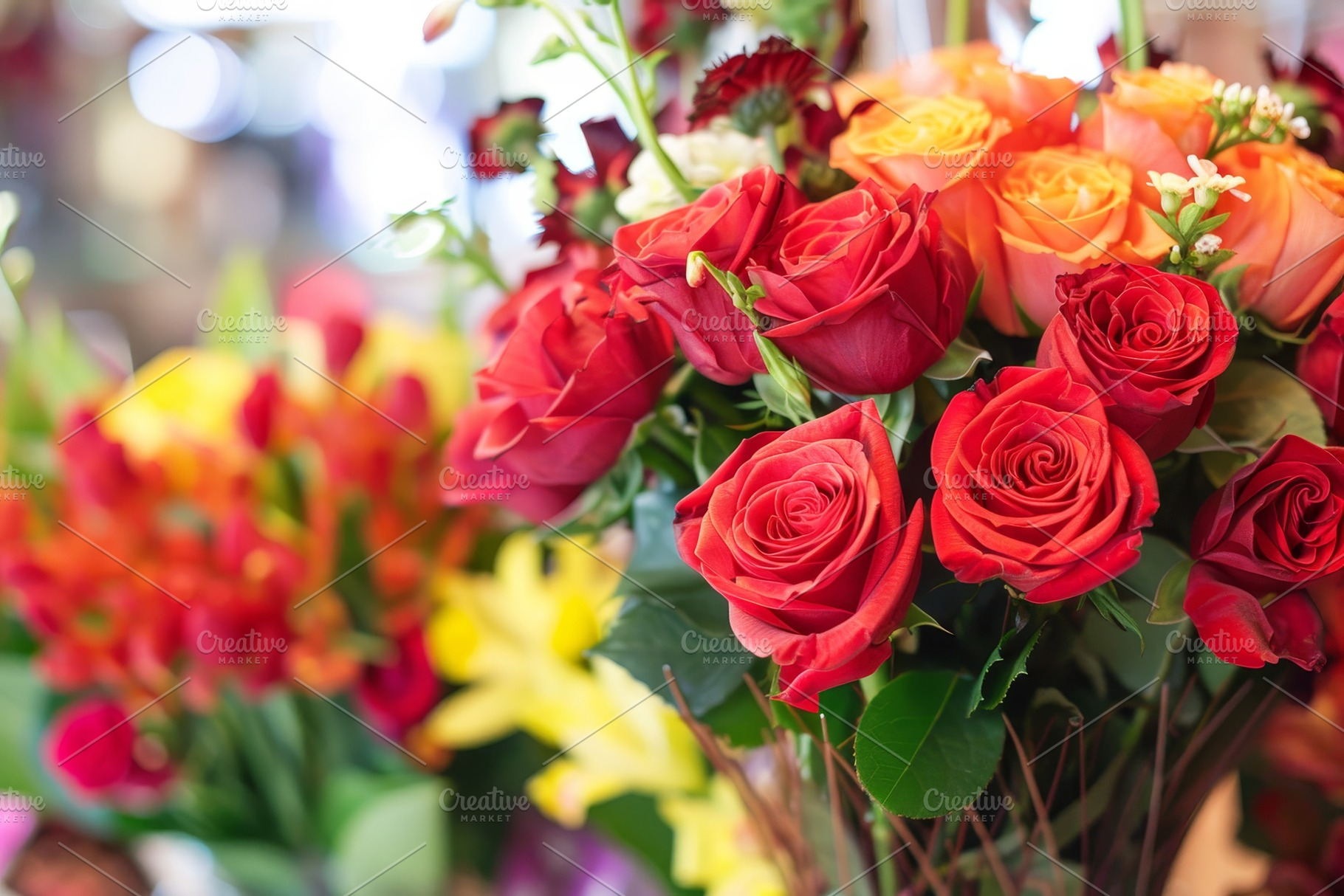 Vibrant Bouquet of Red and Orange Ro, a Photo by Tanuart