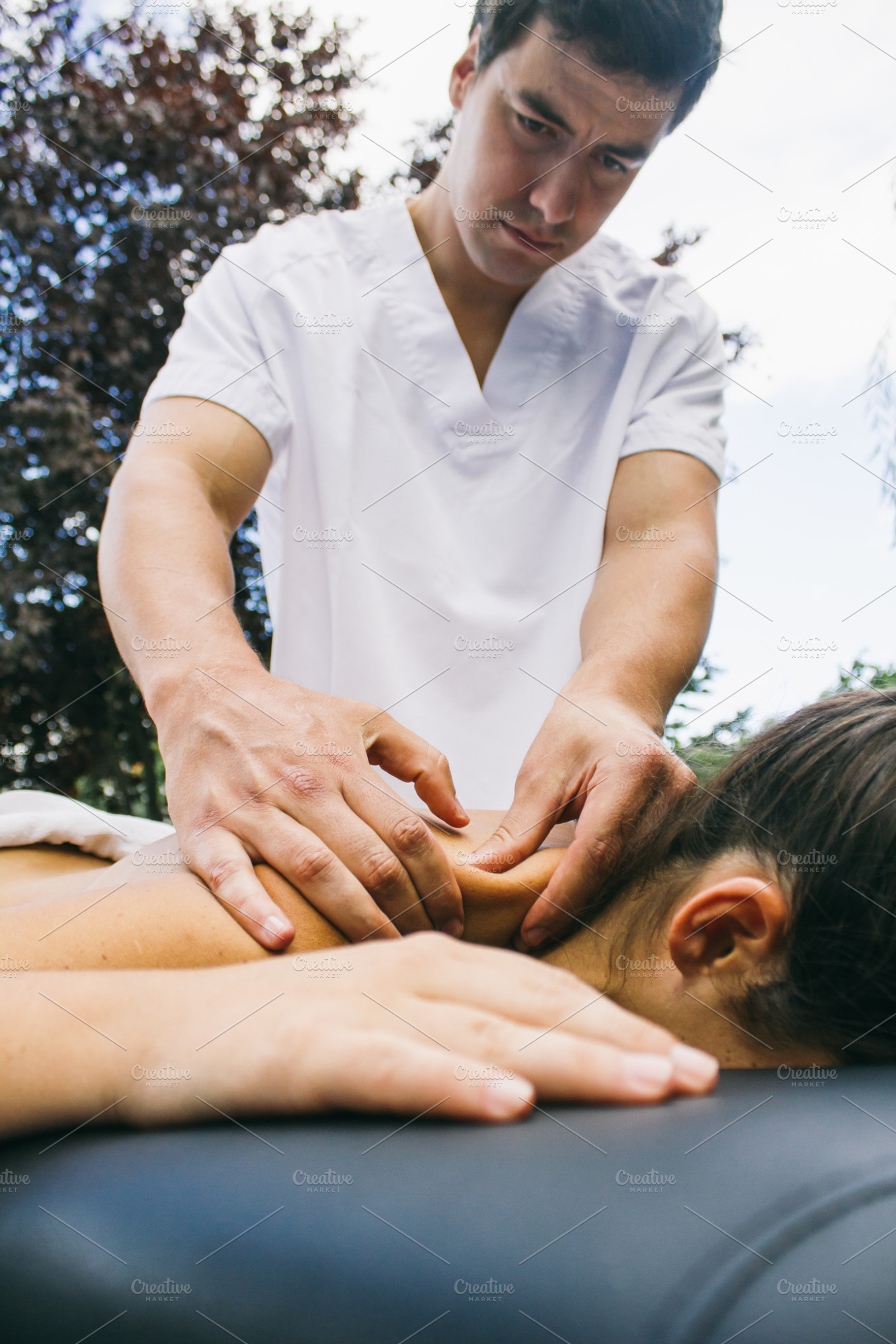 Physiotherapist treating a patient stock photo containing physiotheraphy and, a Health & Medical Photo by Am.Benitez Estudio