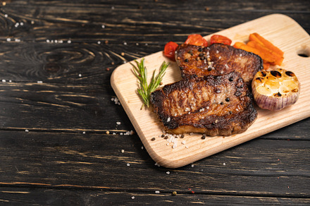 Juicy piece of fried meat lies on a featuring food, fried, and meat, a Food & Drink Photo by andreonegin market