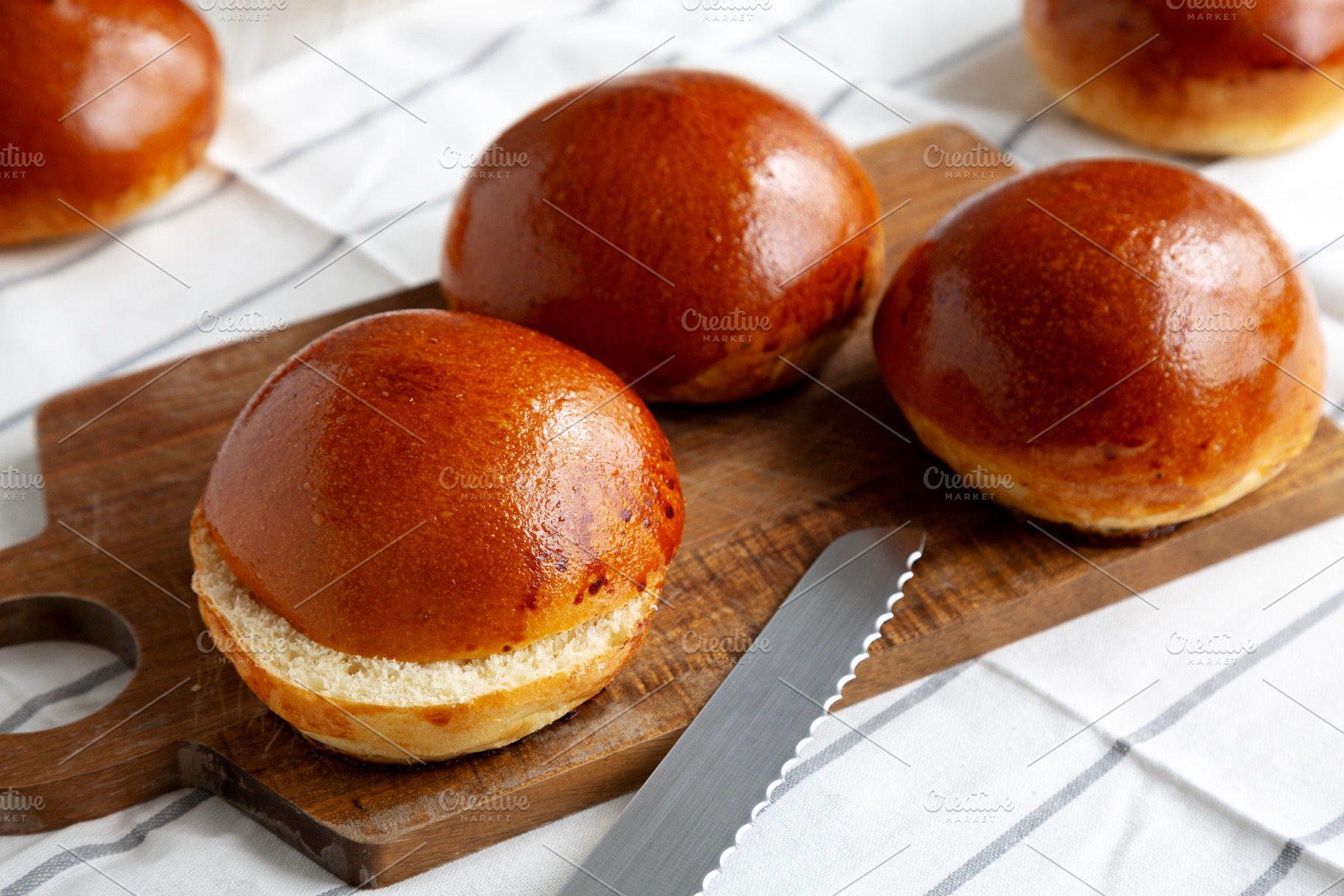 Homemade Brioche Buns Ready to Eat, side view., a Food & Drink Photo by LiudmylaChuhunova