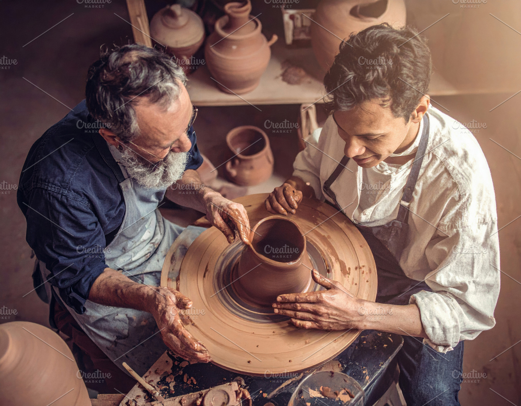 Master Potter Teaching Apprentice at Wheel, an Arts & Entertainment Photo by Davizro's Market