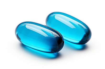 Transparent capsule with yellow powder on isolated background, m, a Health & Medical Photo by ndanko