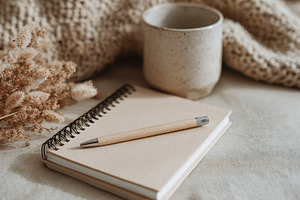Cozy setting with notebook and cup, a Photo by Beautiful things