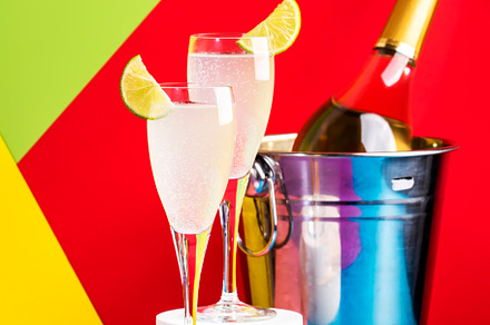 French 75 cocktail with dry gin, prosecco wine, syrup, lime and