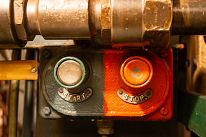 Start and stop buttons inside an old military submarine control, an Industrial Photo by GoodGoods