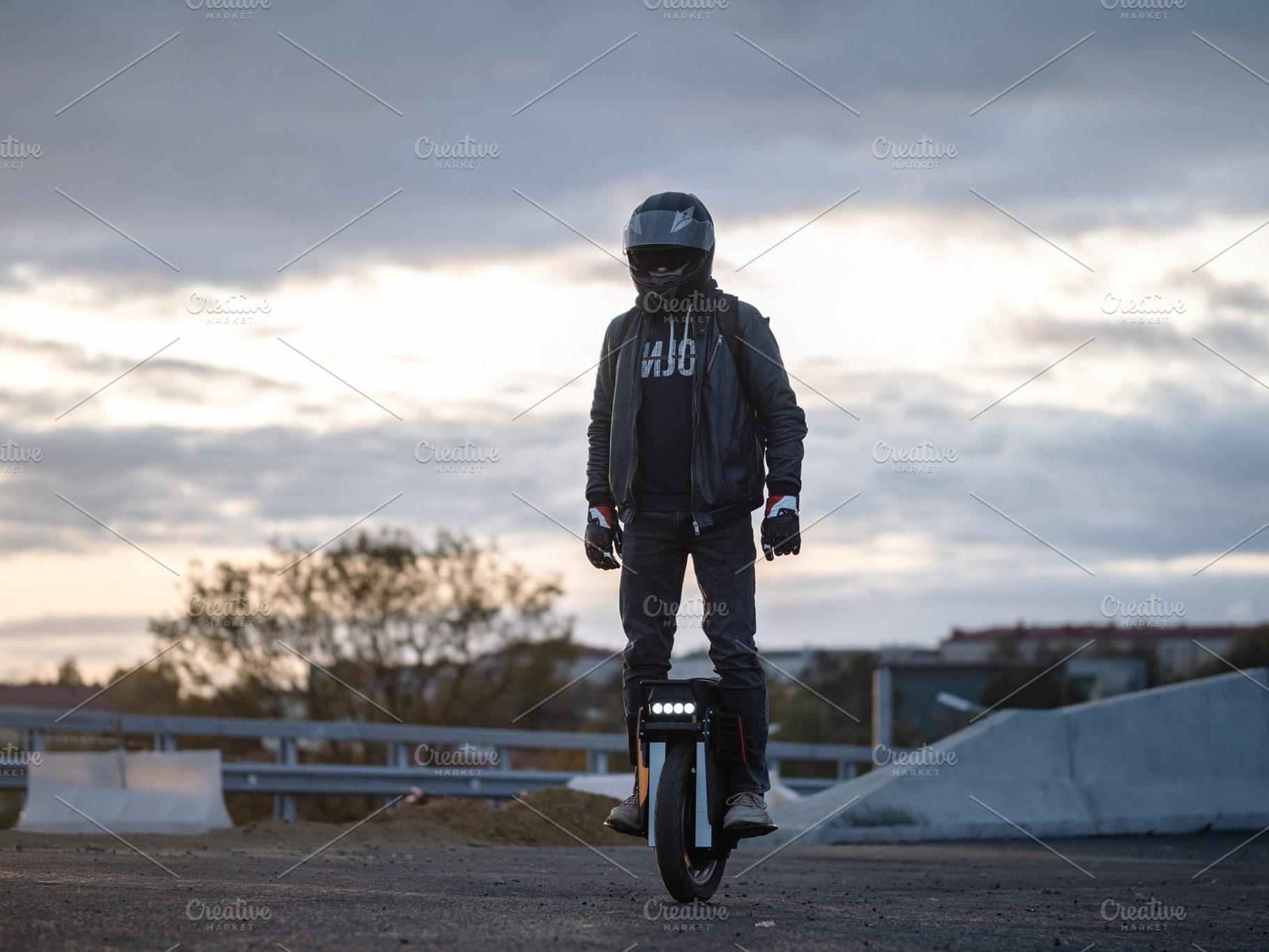 A man rides on an electric unicycle. Mono Wheel riding (EUC) , protective gear, a Person Photo by PavelKant