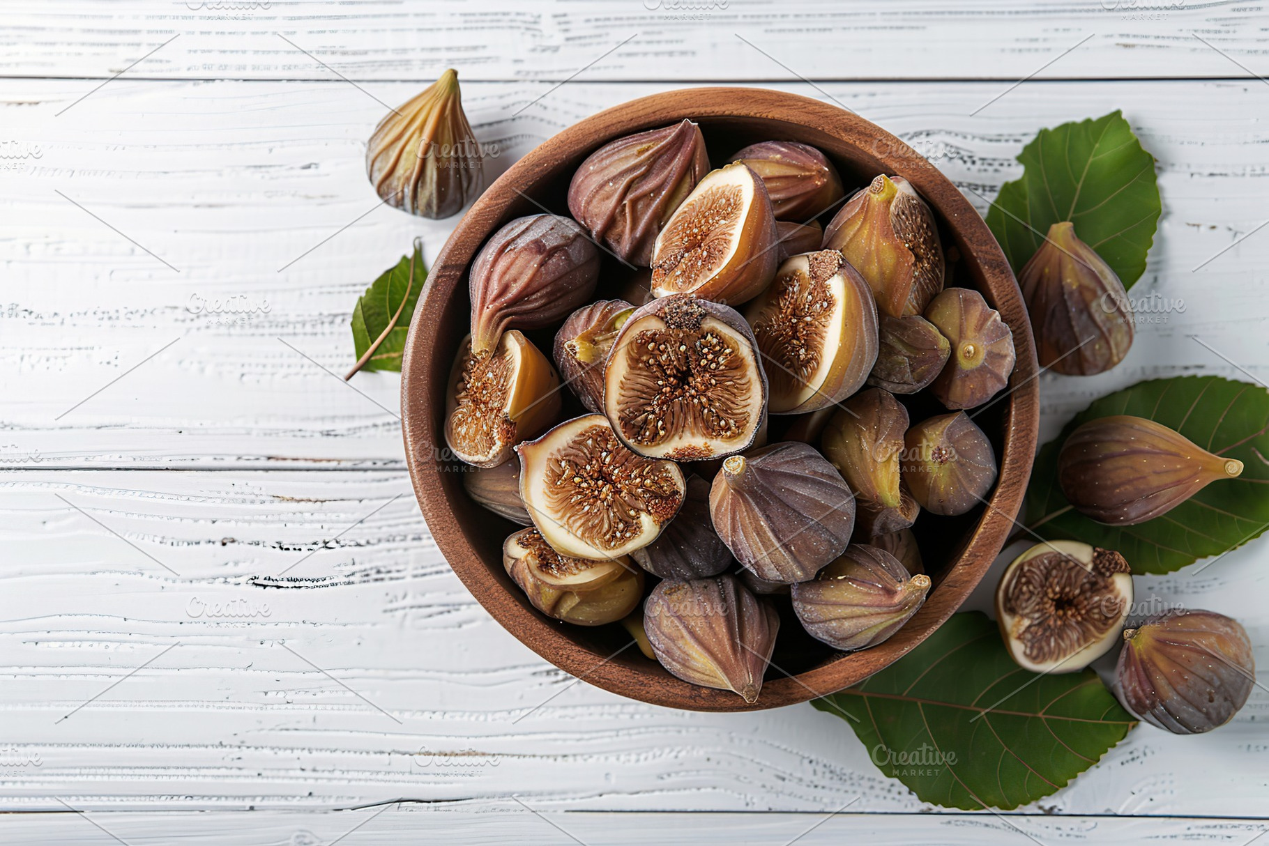 Dried figs fruit in bowl on wooden table, a Food & Drink Photo by AlyaAnd