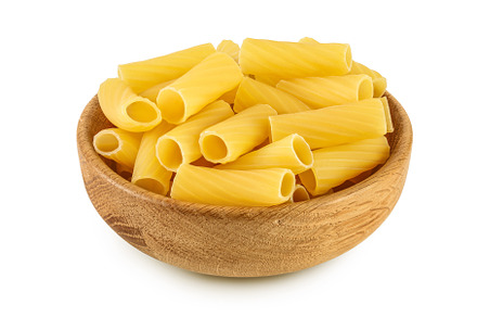 raw italian Rigatoni pasta in wooden, a Food & Drink Photo by NataPhoto