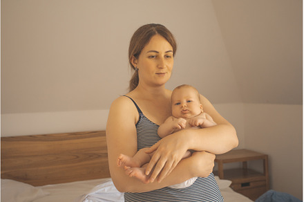 Mother holding baby in the sleeping, a Person Photo by oksix