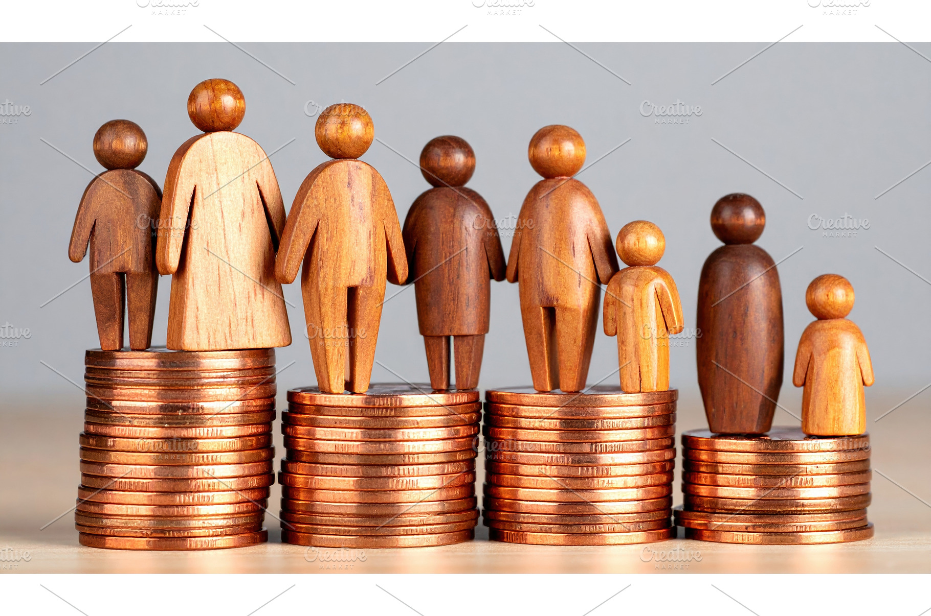 Wooden human figures on stacked, a Business Photo by Igor Tichonow