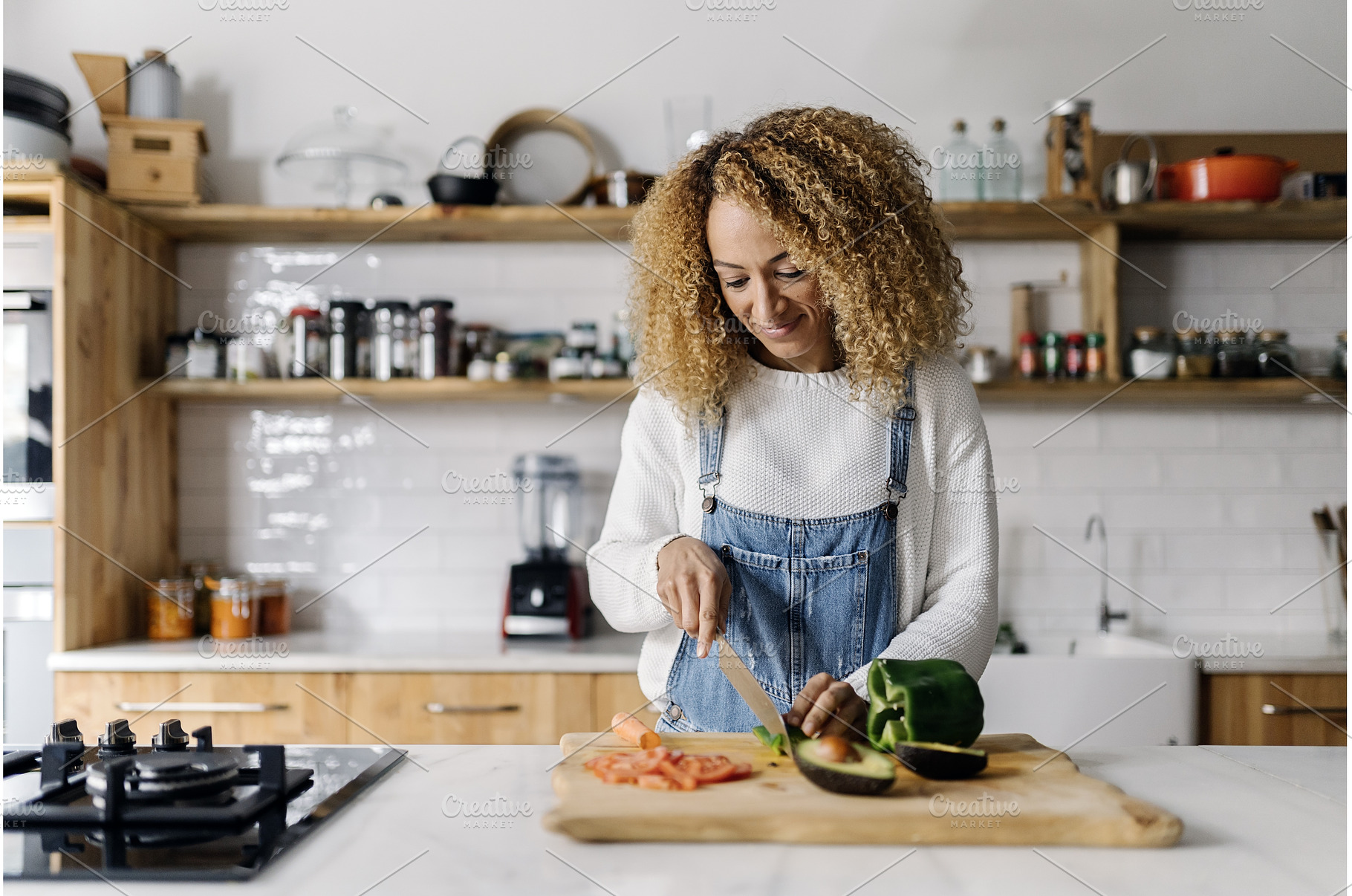 Woman preparing food in kitchen., a Person Photo by nunezimage