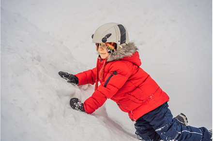 Cute boy climbs on a snowy mountain, a Sports & Recreation Photo by Elizaveta Galitskaya