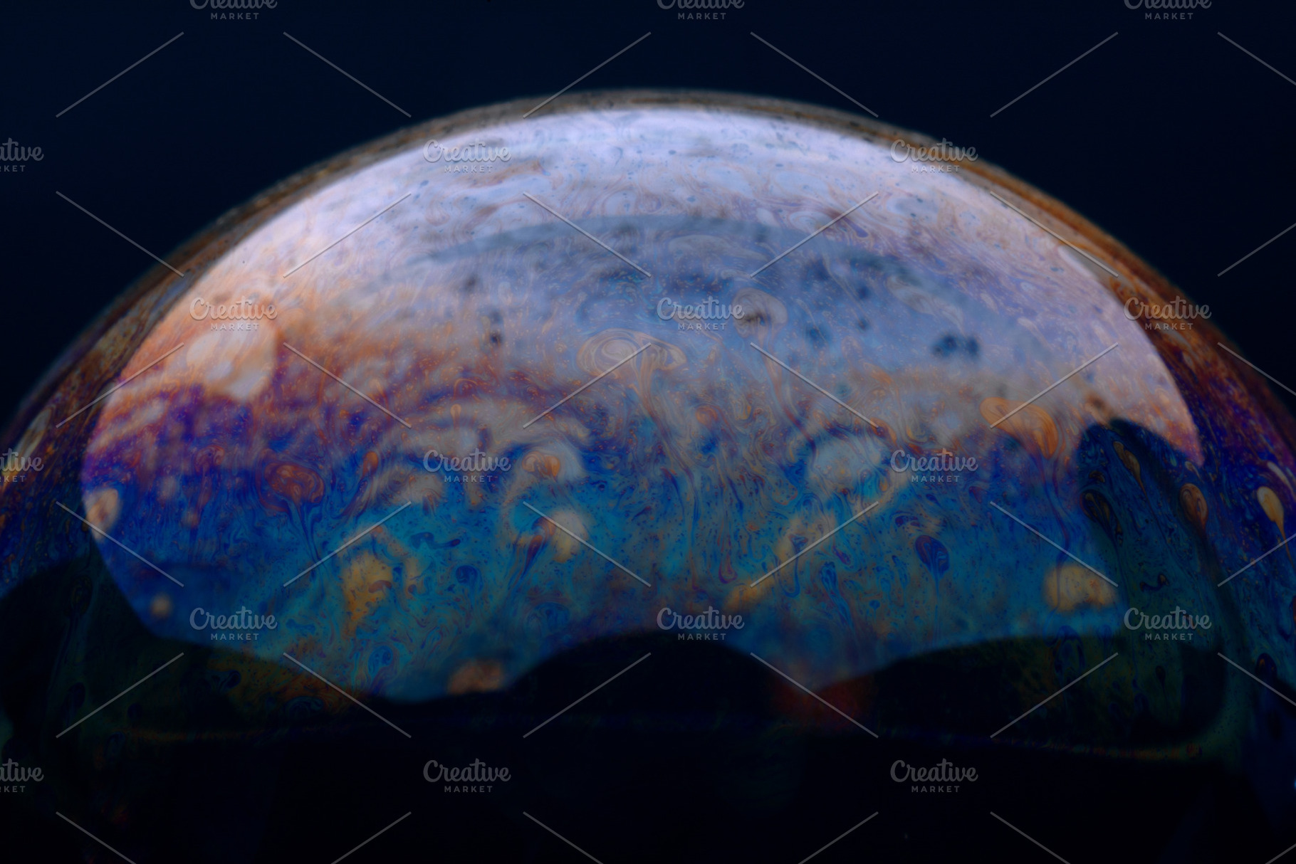 Close-up of a colorful soap bubble showing vibrant swirling patt, a Background Photo by Ales Munt