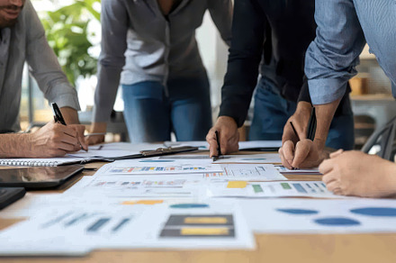 Business team in a brainstorming, a Photo by Pavel_design