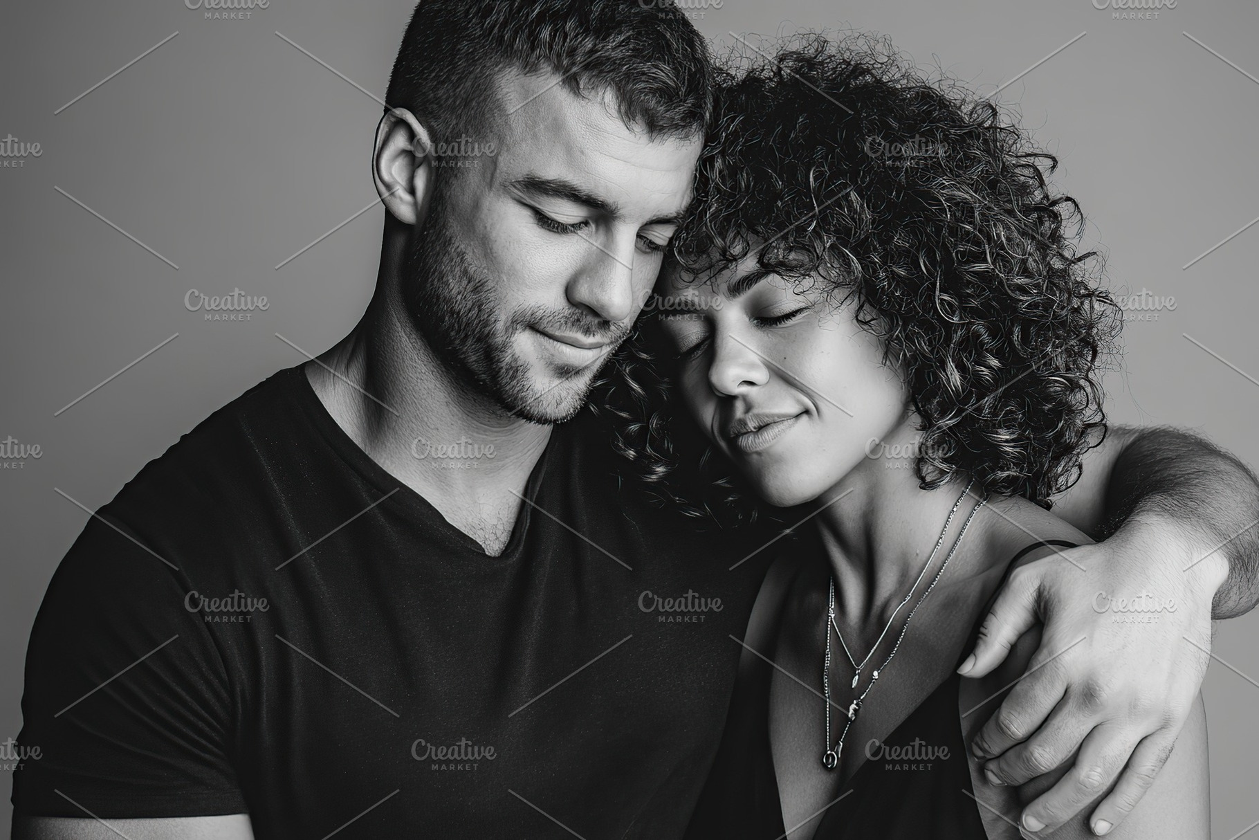 Couple sharing an intimate moment with closed eyes in a warm embrace, a Photo by AlyaAnd
