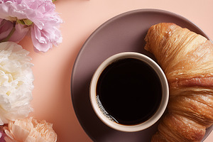 Cup of black coffee and croissant on, a Food & Drink Photo by MistyDay