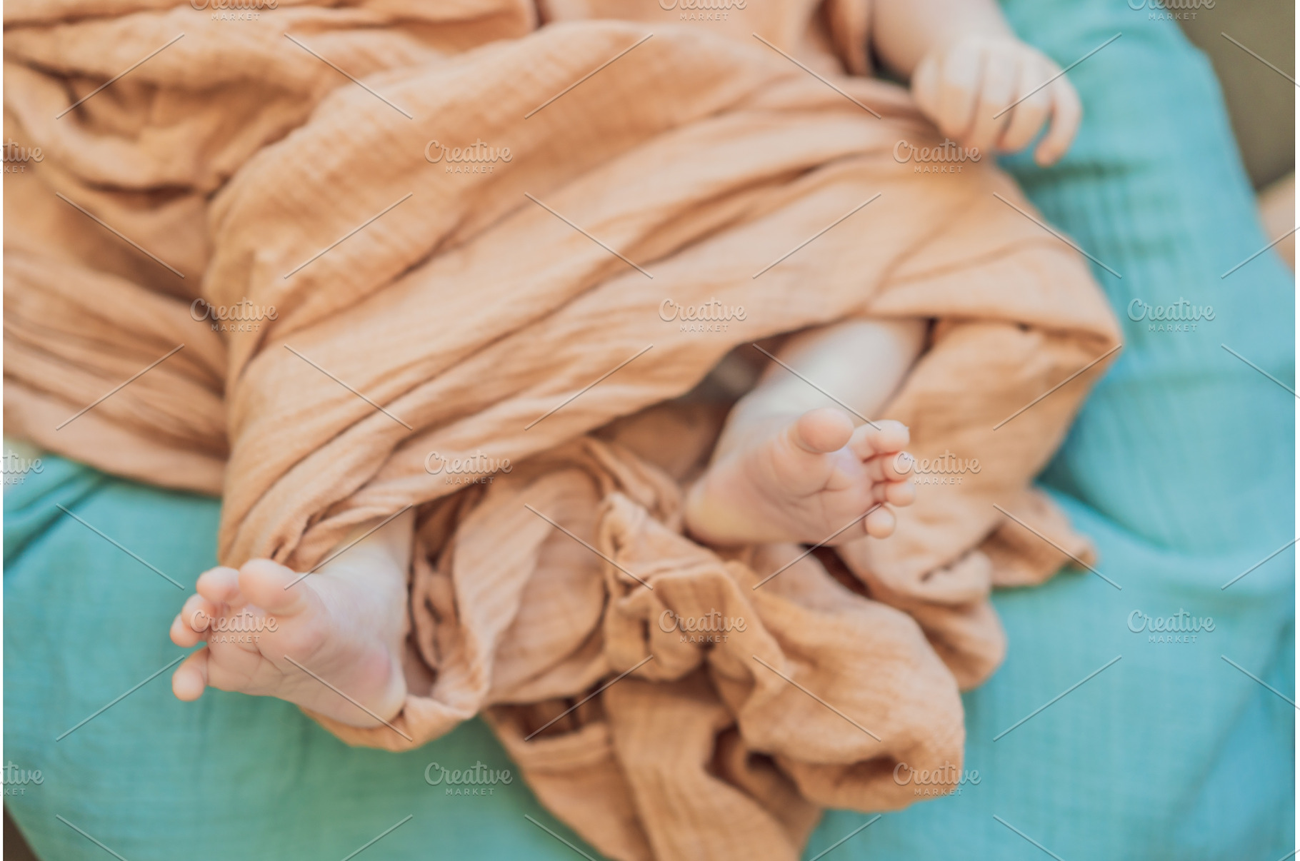 Newborn baby comfortably resting in, a Health & Medical Photo by Elizaveta Galitskaya