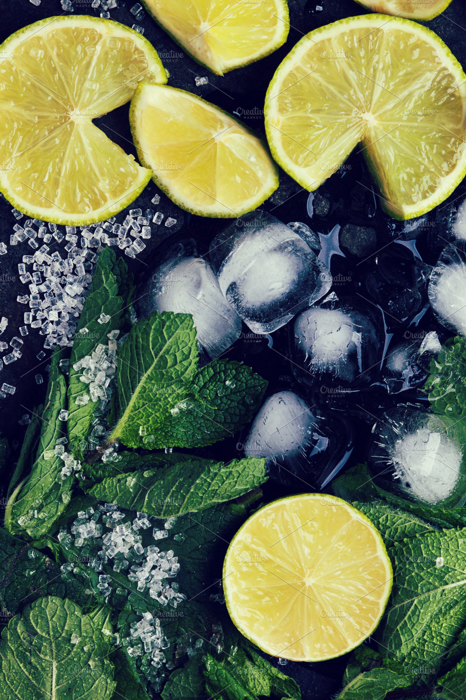 Ingredients for mojito containing mojito, lime, and mint