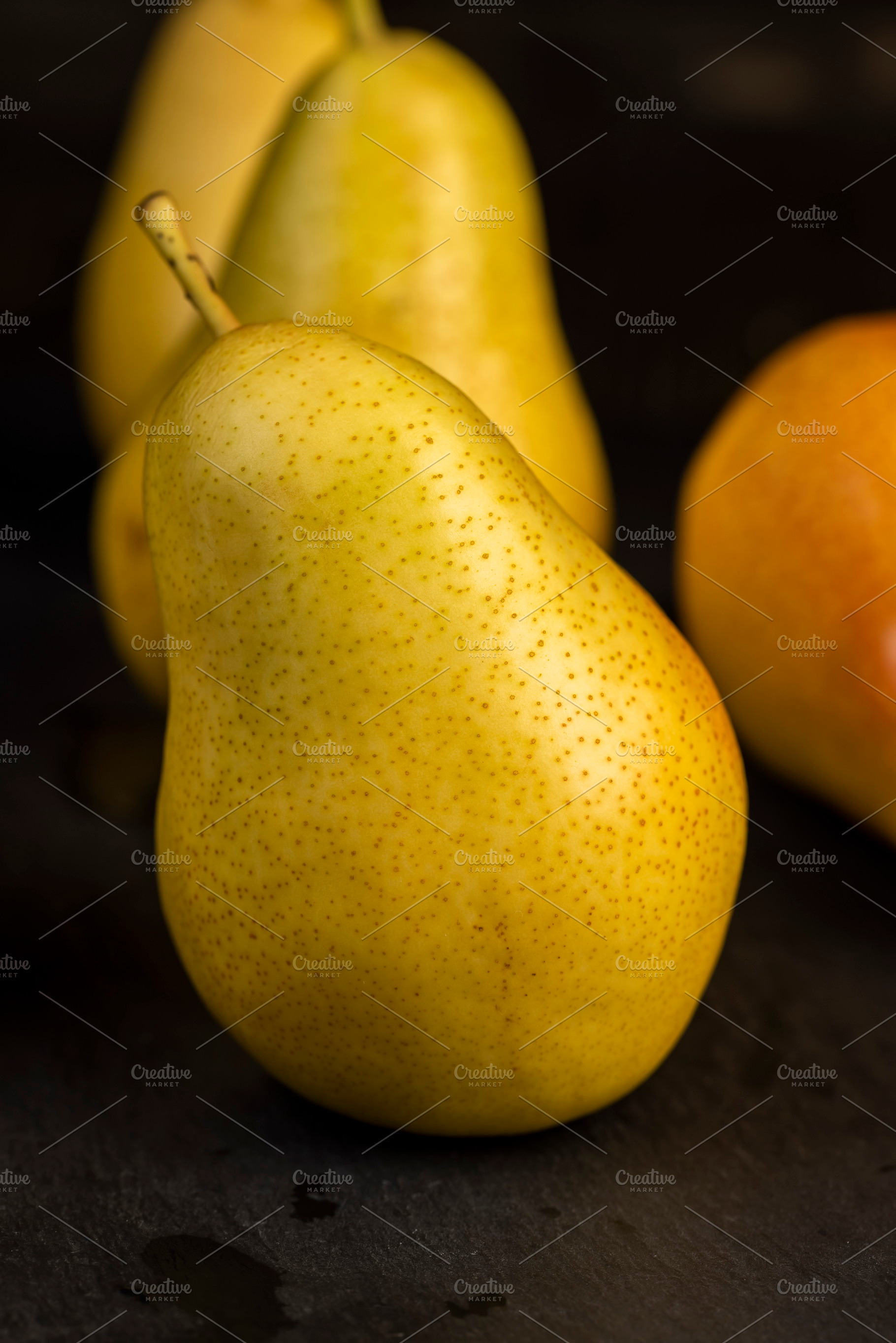 delicious yellow pears with a red side, a Photo by rsoollAI