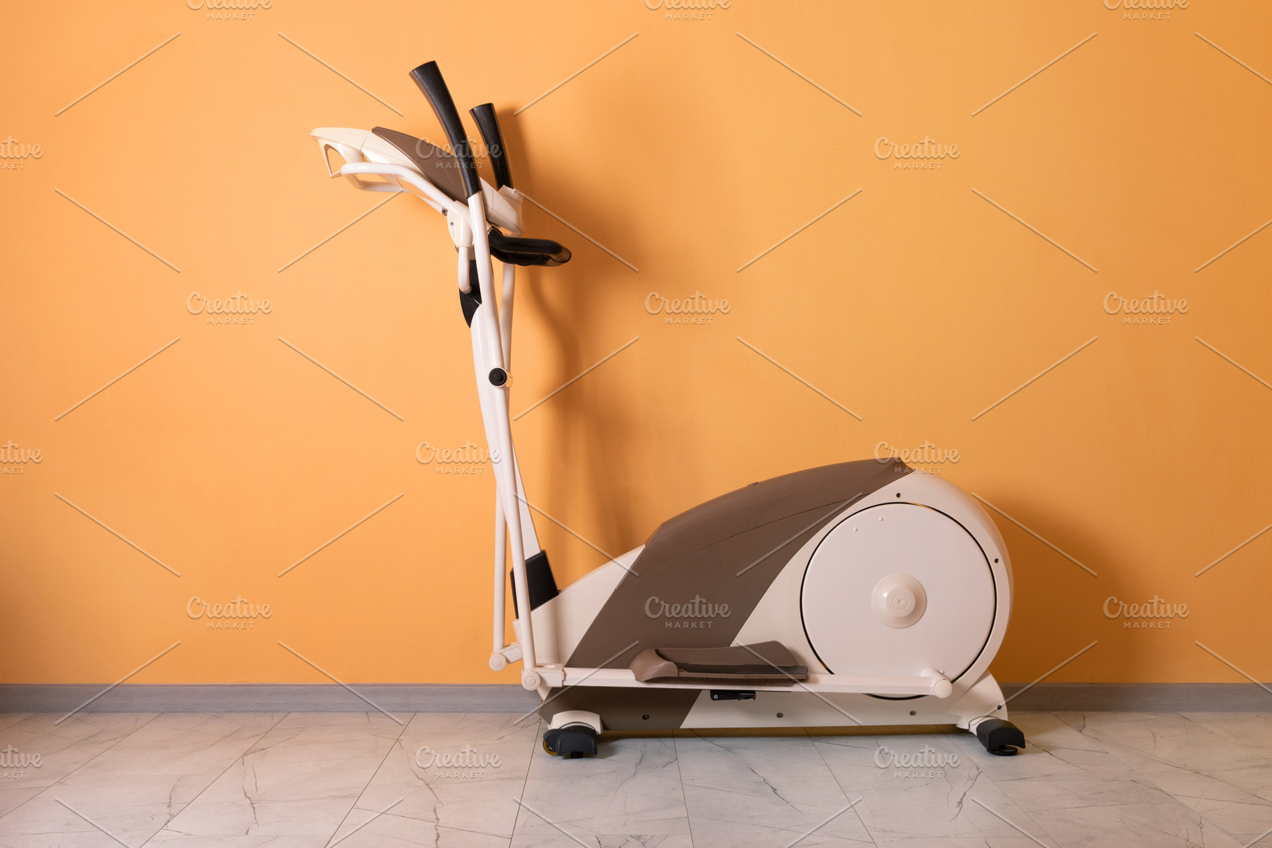Elliptical Trainer on Orange Wall, a Sports & Recreation Photo by Ales Munt