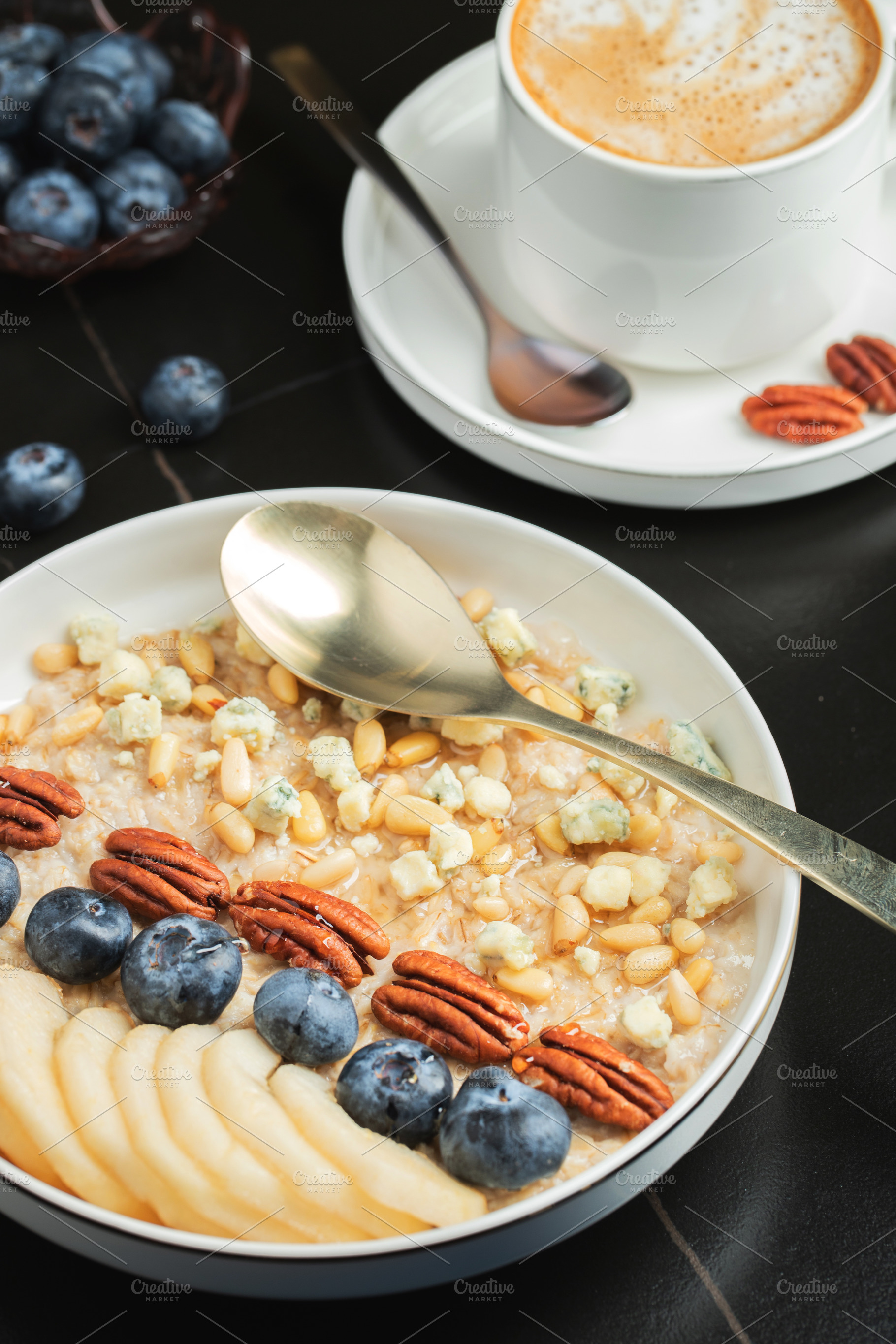 Oatmeal. Bowl of oatmeal porridge with blackberry, bananas and chia seeds on gr, a Food & Drink Photo by Budarinphoto