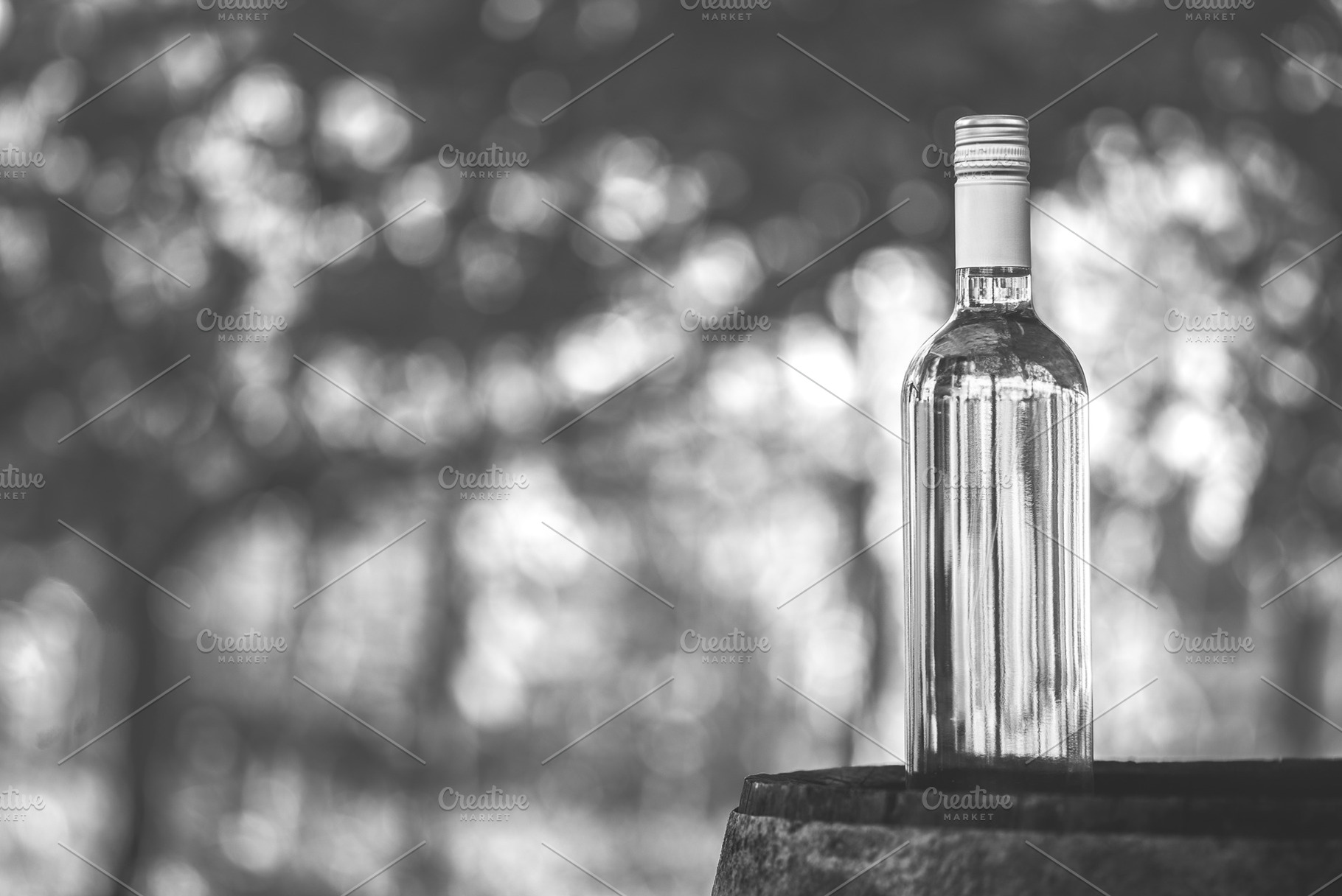 Wine bottle on the barrel, a Food & Drink Photo by Mark Borbely