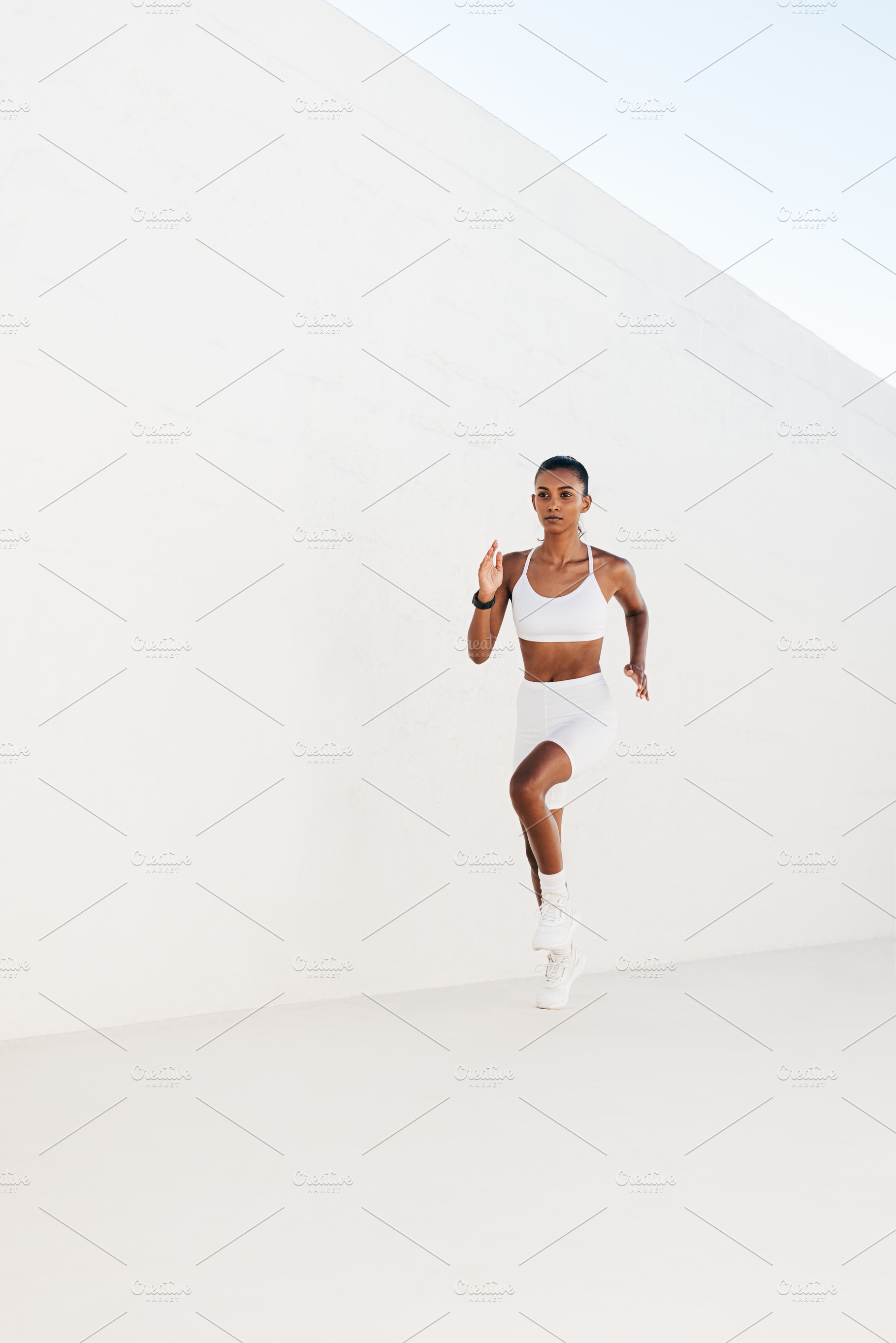 Female runner in white studio, a Sports & Recreation Photo by Artem Varnitsin