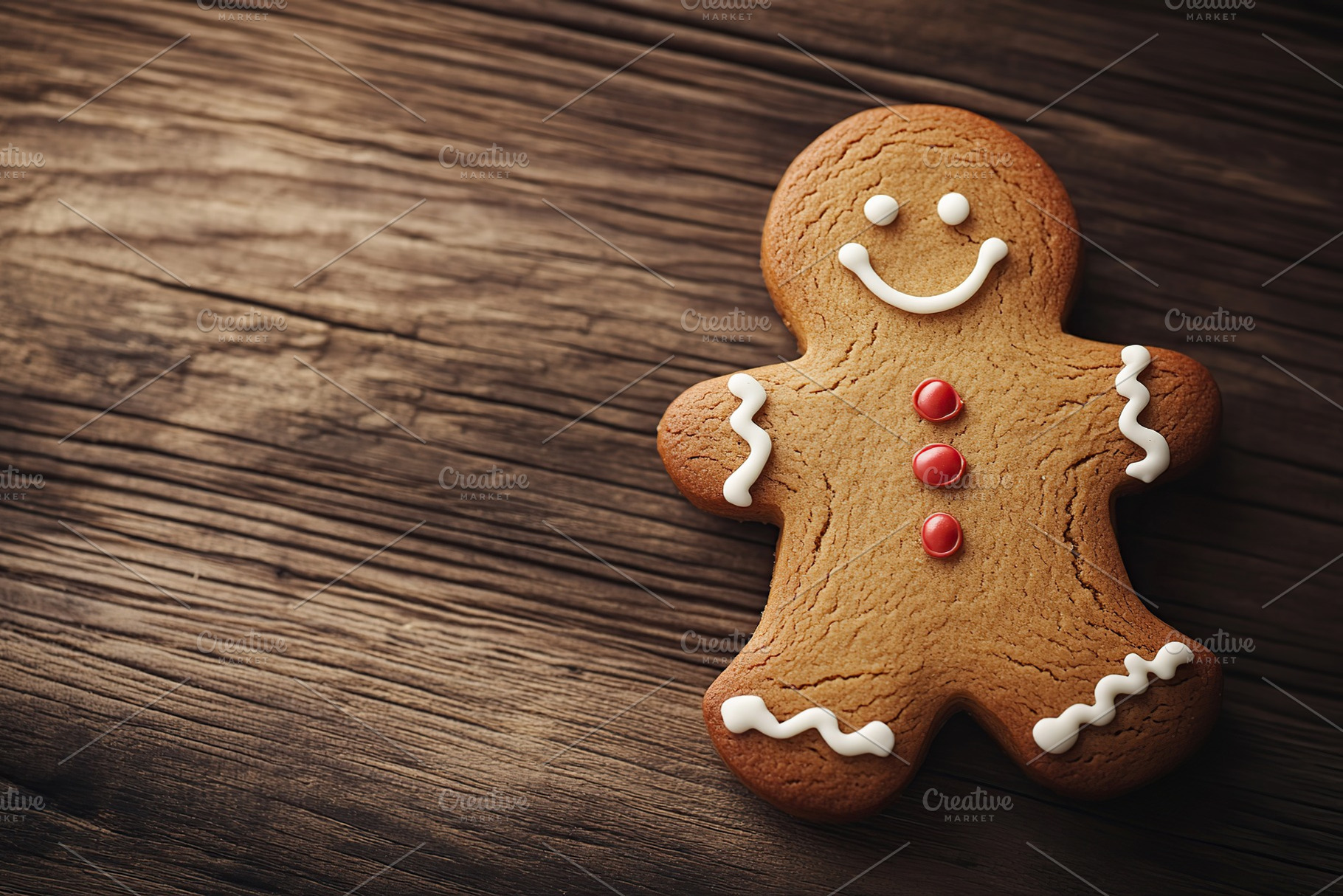 Christmas gingerbread man cookie on wooden table, a Food & Drink Photo by AlyaAnd