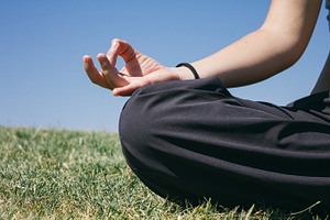 Hand of a woman doing yoga outdoors containing hand, woman, and women