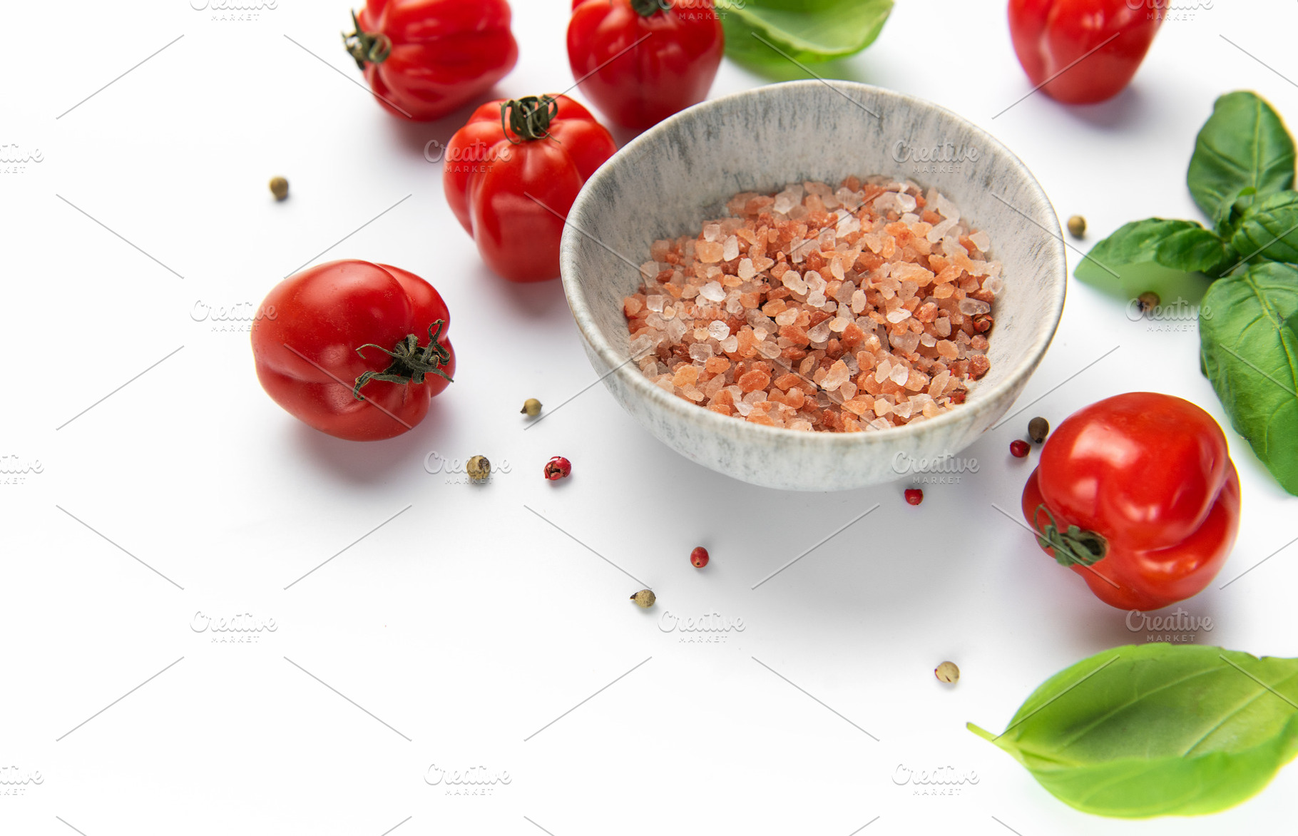 Himalayan pink salt in bowl with fresh organic tomatoes and basi, a Food & Drink Photo by Olena Rudo