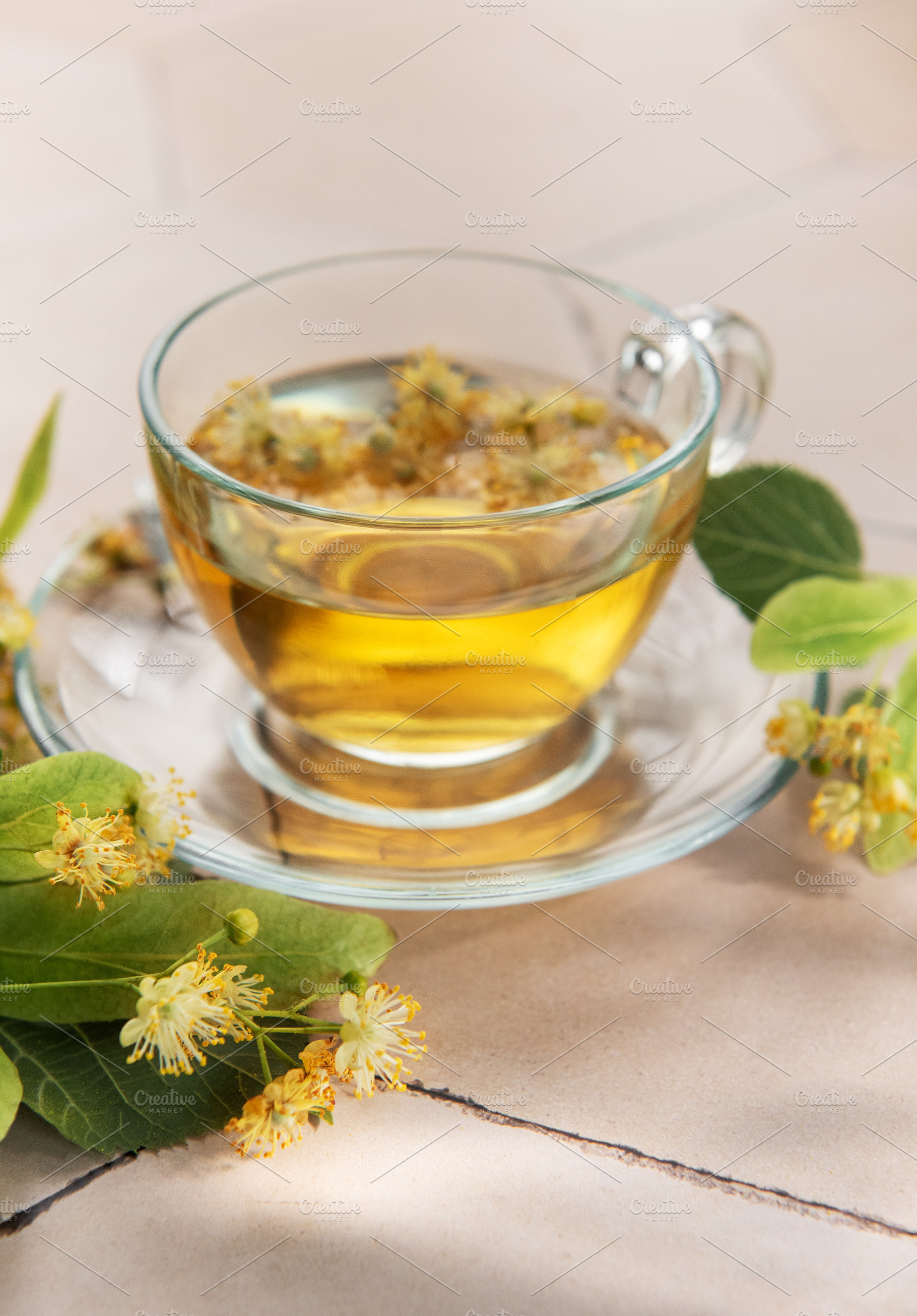 Linden tea cup with fresh lime blossoms, a Food & Drink Photo by Olena Rudo