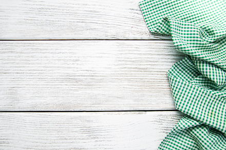 Green napkin containing wooden, background, and table, an Abstract Photo by Olena Rudo