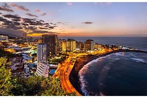 Illuminated coastal city and Lago, an Architecture Photo by Leonid Andronov