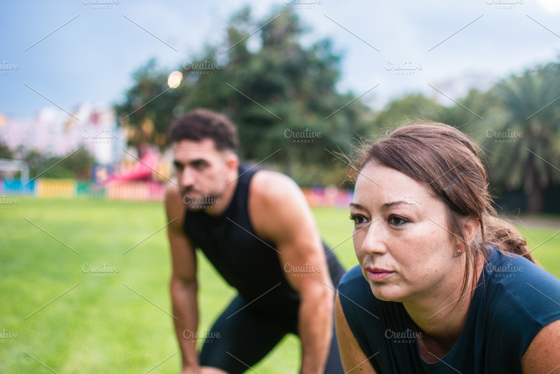 Tired man and woman resting after outdoor fitness workout in park, a Photo by etorres69