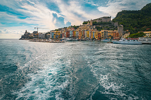 Colorful waterfront buildings, Italy, an Architecture Photo by Alpine Dreams