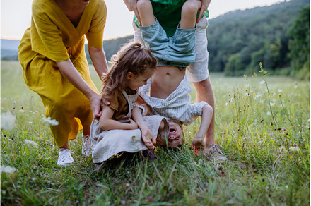 Happy young family having fun, a Person Photo by HalfPoint