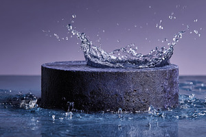 Water Splashing on Dark Cylinder Min, a Photo by Pixeness Studio