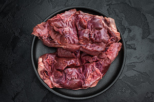 Raw veal hearts prepared for cooking highlighting tender textur, a Food & Drink Photo by composter-box@mail.ru