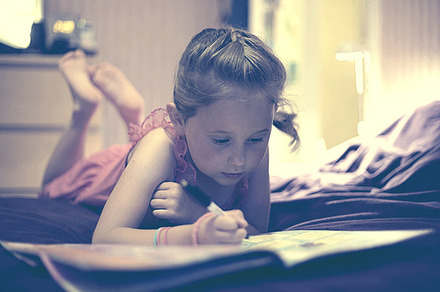 Little Girl Reading and Writing