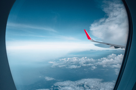 The airplane flew over the clouds., a Transportation Photo by Art Rachen