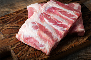 Raw pork ribs with spices, salt and, a Food & Drink Photo by Budarinphoto