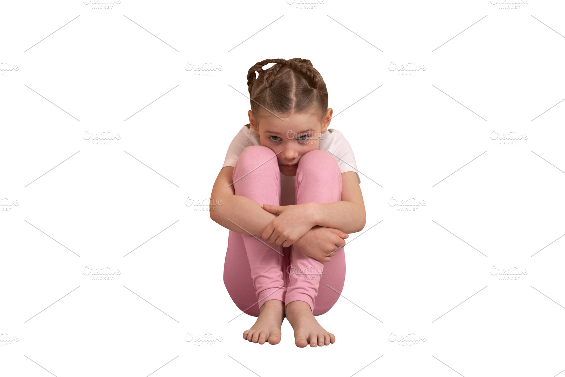 Young girl in pink leggings sitting on floor with knees hugged,, a Person Photo by Ales Munt