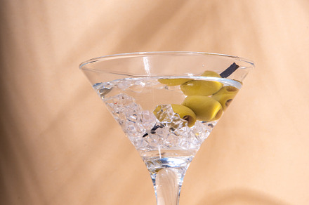 Classic martini cocktail with olive, a Food & Drink Photo by Rimma