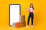 Woman Standing Near Big Phone And Cardboard Boxes, Yellow Background, a Photo by Prostock-Studio (Thumbnail 2 of 2)