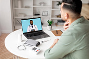 Millennial arab man checks throat, calls online to doctor on laptop screen in l, a Photo by Prostock-Studio (Thumbnail 2 of 2)