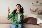 Middle Eastern Lady Wearing Headphones Listening To Music At Home, a Photo by Prostock-Studio (Thumbnail 3 of 3)